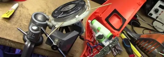 Vacuum cleaner repair parts and tools on a workbench in Dayton, OH